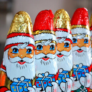 Four foil covered chocolate Santa Clauses