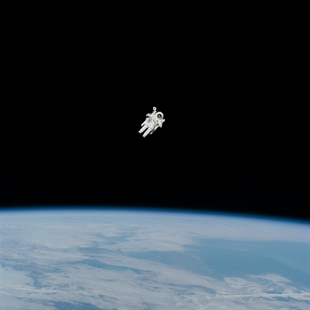 An astronaut floating untethered in space.